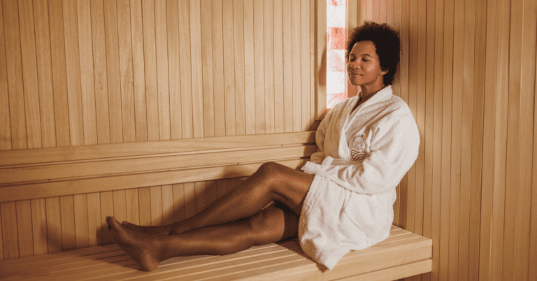 Young Black woman in a sauna to relieve sinus pressure